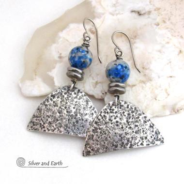 Handcrafted sterling silver earrings with rustic hammered sterling dangles accented with K2 granite gemstones. This unique, interesting stone has beautiful blue azurite inclusions within a black and white speckled granite base.