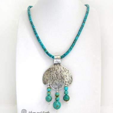 This handcrafted sterling silver necklace is accented with dangling stacks of turquoise beads. It comes on a turquoise heishi necklace with a sterling silver lobster claw closure. It has a modern, earthy southwestern style and will make a bold statement. Perfect for women that love unique artisan made jewelry and the southwest style. Handmade in the USA by Silver and Earth Jewelry, a New Mexico True Certified business. 