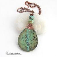 This one-of-a-kind necklace features a natural African turquoise stone wrapped in copper wire and accented with African turquoise stone beads. The stone has an earthy, organic feel with hues of dark blue-green, along with a subtle natural black matrix. It will make a great gift for a natural stone lover - or a nice addition to your own jewelry collection. 
