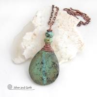 This one-of-a-kind necklace features a natural African turquoise stone wrapped in copper wire and accented with African turquoise stone beads. The stone has an earthy, organic feel with hues of dark blue-green, along with a subtle natural black matrix. It will make a great gift for a natural stone lover - or a nice addition to your own jewelry collection. 