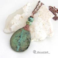 This one-of-a-kind necklace features a natural African turquoise stone wrapped in copper wire and accented with African turquoise stone beads. The stone has an earthy, organic feel with hues of dark blue-green, along with a subtle natural black matrix. It will make a great gift for a natural stone lover - or a nice addition to your own jewelry collection. 