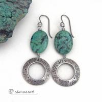 These handcrafted earrings feature natural African turquoise stones accented with silver tone pewter dangles with a hand stamped texture and oxidized finish. They have an earthy, modern style with a touch of southwestern flair. Matching necklace sold separately. Handmade in the USA by Silver and Earth Jewelry. 