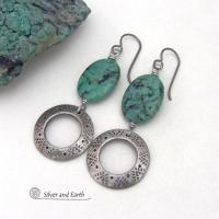 These handcrafted earrings feature natural African turquoise stones accented with silver tone pewter dangles with a hand stamped texture and oxidized finish. They have an earthy, modern style with a touch of southwestern flair. Matching necklace sold separately. Handmade in the USA by Silver and Earth Jewelry. 