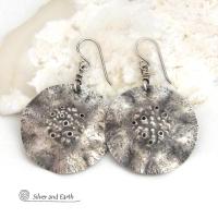 These handcrafted solid sterling silver earrings have a modern, organic earthy style with an edgy vibe. Perfect for everyday wear - they go with everything. They feature large round sterling silver dangles with a bumpy hammered texture and a rustic oxidized satin finish. 