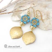 These handcrafted earrings feature gold brass dangles with a lightly hammered raw silk texture accented with glass flower beads and shiny brass beads. The flowers are a pretty shade of "bluish-turquoise" accented with gold details. These earrings have a modern elegant, earthy chic style and will make a great gift for anyone that loves flowers and nature. They'll make a great addition to your spring / summer wardrobe - or any time of year. 