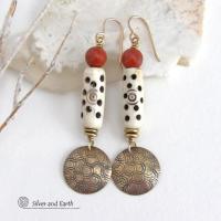 These handcrafted earrings feature a carved African bone beads, red jasper gemstones and textured gold brass dangles. Unique and striking, they have a boho chic style with lots of tribal flair. Perfect for women that love to wear bold unique artisan handmade jewelry. Handmade in the USA by Silver and Earth Jewelry. 