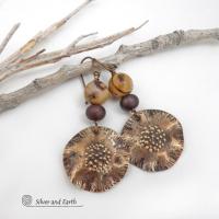 These earrings feature hand-forged bronze metal dangles accented with natural jasper stones and bronze glass beads. They have an earthy, modern boho feel that makes a striking statement. Perfect for women that love unique artisan handcrafted jewelry, earthy hammered textures and natural stones. Handmade in the USA by Silver and Earth Jewelry.