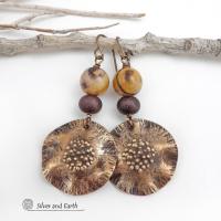 These earrings feature hand-forged bronze metal dangles accented with natural jasper stones and bronze glass beads. They have an earthy, modern boho feel that makes a striking statement. Perfect for women that love unique artisan handcrafted jewelry, earthy hammered textures and natural stones. Handmade in the USA by Silver and Earth Jewelry.