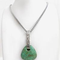 This one-of-a-kind pendant necklace features a beautiful chunky natural chrysocolla gemstone with a faceted finish. The stone is a beautiful shade of bluish-green which resembles turquoise. It hangs from a hand forged solid sterling silver bail with a lightly hammered organic texture. The pendant is reversible. (See all photos for alternate sides). Unique and one-of-a-kind, it's sure to make a statement. Makes a great gift for a natural stone lover - or a nice addition to your own jewelry wardrobe. 