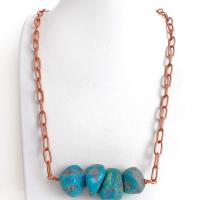 This chunky turquoise necklace features big, organically-shaped nuggets of genuine natural turquoise accented with a copper link chain. The turquoise is a stunning shade of blue - reminiscent of the lovely blue skies here in the American Southwest. Unique and one-of-a-kind, it will make a bold statement. Perfect for women that love bold unique jewelry made with natural stones. Handmade in the USA by Silver and Earth Jewelry. 