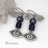 These unique earrings feature black eye agate and onyx stones accented with silver pewter "evil eye" charms. When cut at the right angle, this type of agate reveals a series of concentric rings that resembles the human eye. Evil eye symbolism has been around for centuries. The belief is that when worn -- evil eye jewelry will provide a level of protection against the envy and negative energy of others and perhaps bring the wearer good luck.