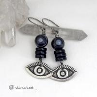 These unique earrings feature black eye agate and onyx stones accented with silver pewter "evil eye" charms. When cut at the right angle, this type of agate reveals a series of concentric rings that resembles the human eye. Evil eye symbolism has been around for centuries. The belief is that when worn -- evil eye jewelry will provide a level of protection against the envy and negative energy of others and perhaps bring the wearer good luck.
