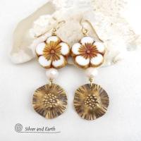 These handcrafted earrings feature large stunning white glass flower beads with golden highlights accented with gold brass dangles with a hand textured design and white faceted crystal beads which add sparkle and shine. They have an elegant, modern chic style and will make a great gift for anyone that loves flowers and nature. Perfect for your spring / summer wardrobe -- or any time of year. 