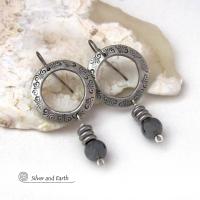 These silver pewter hoop earrings have a hand stamped texture and are accented with hematite gemstones and stainless steel beads. The stones have a metallic gray hue which cast offs a bit of natural shimmer & shine. They have a modern chic style that coordinates beautifully with all wardrobe styles. Earrings are lightweight and comfortable to wear. Handmade in the USA by Silver and Earth Jewelry. 