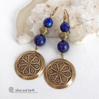 These handcrafted gold brass earrings have an exotic, Egyptian inspired vibe. They feature brass circle dangles with a beautiful embossed texture accented with faceted genuine lapis lazuli gemstones and textured brass beads. Bold and unique, they'll add a touch of cultural exotic charm to any type of wardrobe - dressed up or down. Perfect for women that love unique artisan handcrafted jewelry. Handmade in the USA by Silver and Earth Jewelry. 