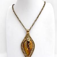 This necklace features a golden brown carved Mother of Pearl leaf accented against a handcrafted gold brass base. I hand sawed the base out of solid gold brass sheet and stamped the metal with a leaf pattern to "echo" the Mother of Pearl leaf. Unique and one-of-kind, it'll make a great gift for a nature lover - or a nice addition to your own jewelry wardrobe. It comes on an 18" antiqued brass chain with lobster claw closure. Handmade in the USA by Silver and Earth Jewelry. 