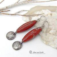 These handmade earrings feature natural red jasper gemstones accented with small hammered sterling silver dangles. The stones have a brick red hue with an interesting matrix of beige streaks and squiggly lines. They have a modern, earthy appeal that coordinates well with all wardrobe styles. They'll make a great gift for a natural stone lover - or a nice addition to your own jewelry wardrobe. They have a coordinating necklace which is sold separately. Handmade in the USA by Silver and Earth Jewelry.  
