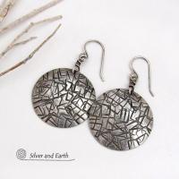 These handcrafted sterling silver earrings have a simplistic, modern style that is perfect for everyday wear because they go with everything. They have a hand stamped abstract texture that was oxidized to highlight the details. Lightweight and comfortable to wear, they'll coordinate beautifully with all wardrobe styles. 