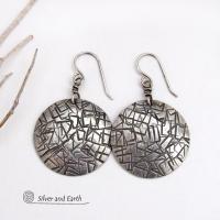 These handcrafted sterling silver earrings have a simplistic, modern style that is perfect for everyday wear because they go with everything. They have a hand stamped abstract texture that was oxidized to highlight the details. Lightweight and comfortable to wear, they'll coordinate beautifully with all wardrobe styles. 