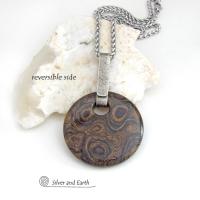 This one-of-a-kind necklace features a natural stromatolite fossil stone accented with a hand forged sterling silver bail with a lightly hammered organic texture. Stromatolites are fossilized layered deposits of algae within ancient sedimentary rock. These old single-celled organisms are believed to be some of the first forms of life on this planet.
