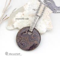 This one-of-a-kind necklace features a natural stromatolite fossil stone accented with a hand forged sterling silver bail with a lightly hammered organic texture. Stromatolites are fossilized layered deposits of algae within ancient sedimentary rock. These old single-celled organisms are believed to be some of the first forms of life on this planet.
