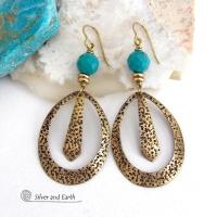 These handcrafted gold brass hoop earrings have a hand stamped texture and are accented with beautiful genuine turquoise gemstones with a faceted finish and small brass beads. They have an exotic boho chic design with an Egyptian inspired vibe and flair. Suitable for any occasion - they'll look great dressed up or down. Perfect for women that love to wear artisan handcrafted jewelry that makes a bold statement. Earrings are lightweight and comfortable to wear. Handmade in the USA by Silver and Earth Jewelry