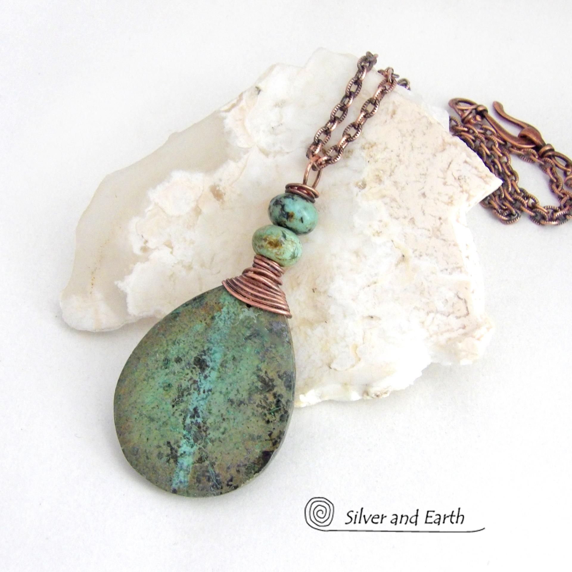 This one-of-a-kind necklace features a natural African turquoise stone wrapped in copper wire and accented with African turquoise stone beads. The stone has an earthy, organic feel with hues of dark blue-green, along with a subtle natural black matrix. It will make a great gift for a natural stone lover - or a nice addition to your own jewelry collection. 