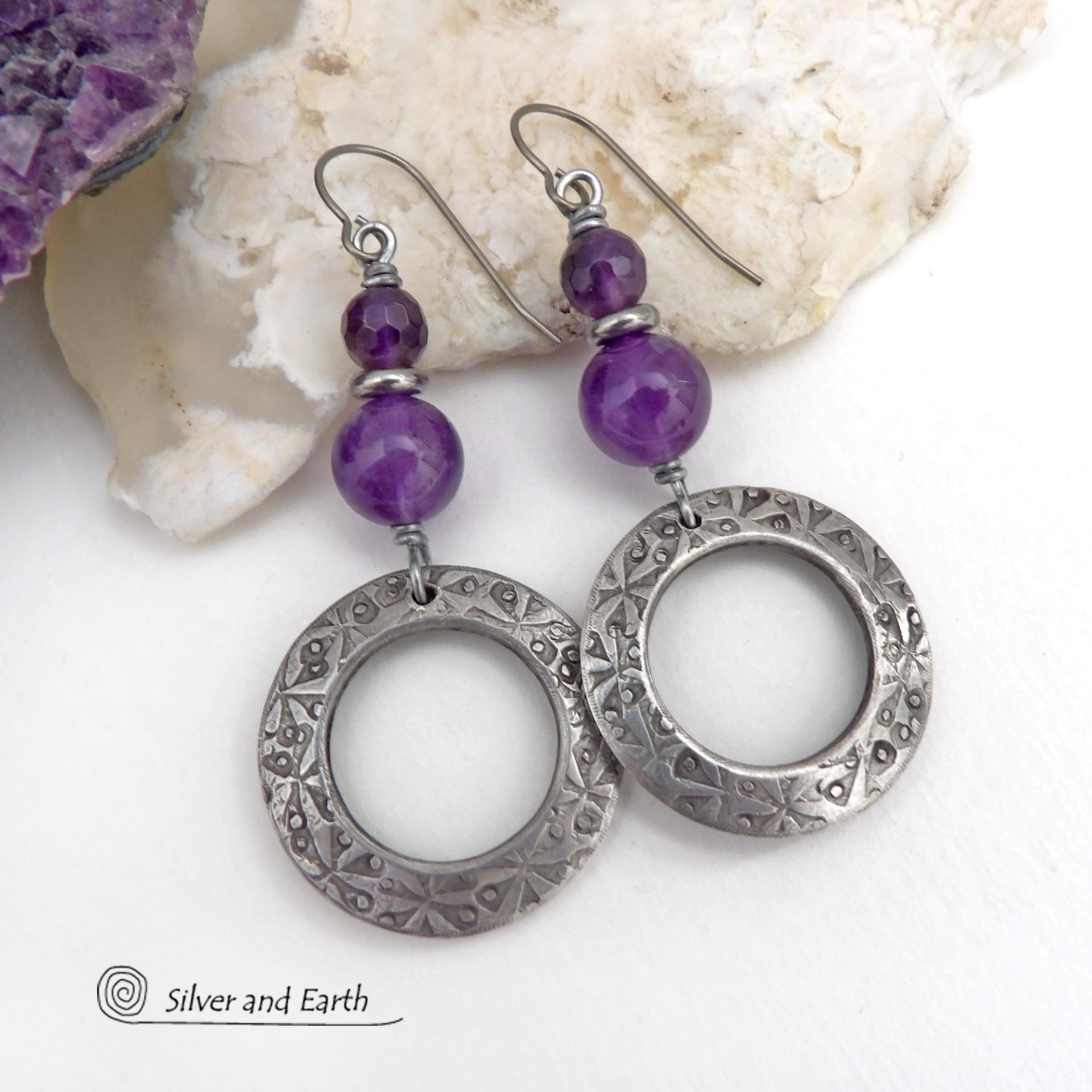 These handcrafted silver pewter hoop earrings have a hand stamped texture and are accented with a stack of purple amethyst gemstones and tiny stainless steel spacer beads. They have a modern, elegant chic style that will look great with all wardrobe styles - dressed up or down. Makes a great gift for someone with a February birthday - amethyst is that month's birthstone. Handmade in the USA by Silver and Earth Jewelry.