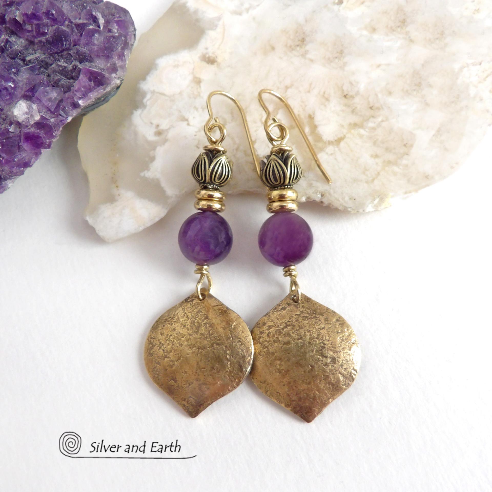 These handcrafted gold brass earrings have a hammered raw silk texture and are accented with natural purple amethyst gemstones, tiny brass beads and tulip flower-shaped brass beads. They have a modern elegant chic style that coordinates beautifully with all wardrobe types - dressed up or down. Makes a great gift for someone with a February birthday - amethyst is that month's birthstone. Handmade in the USA by Silver and Earth Jewelry. 