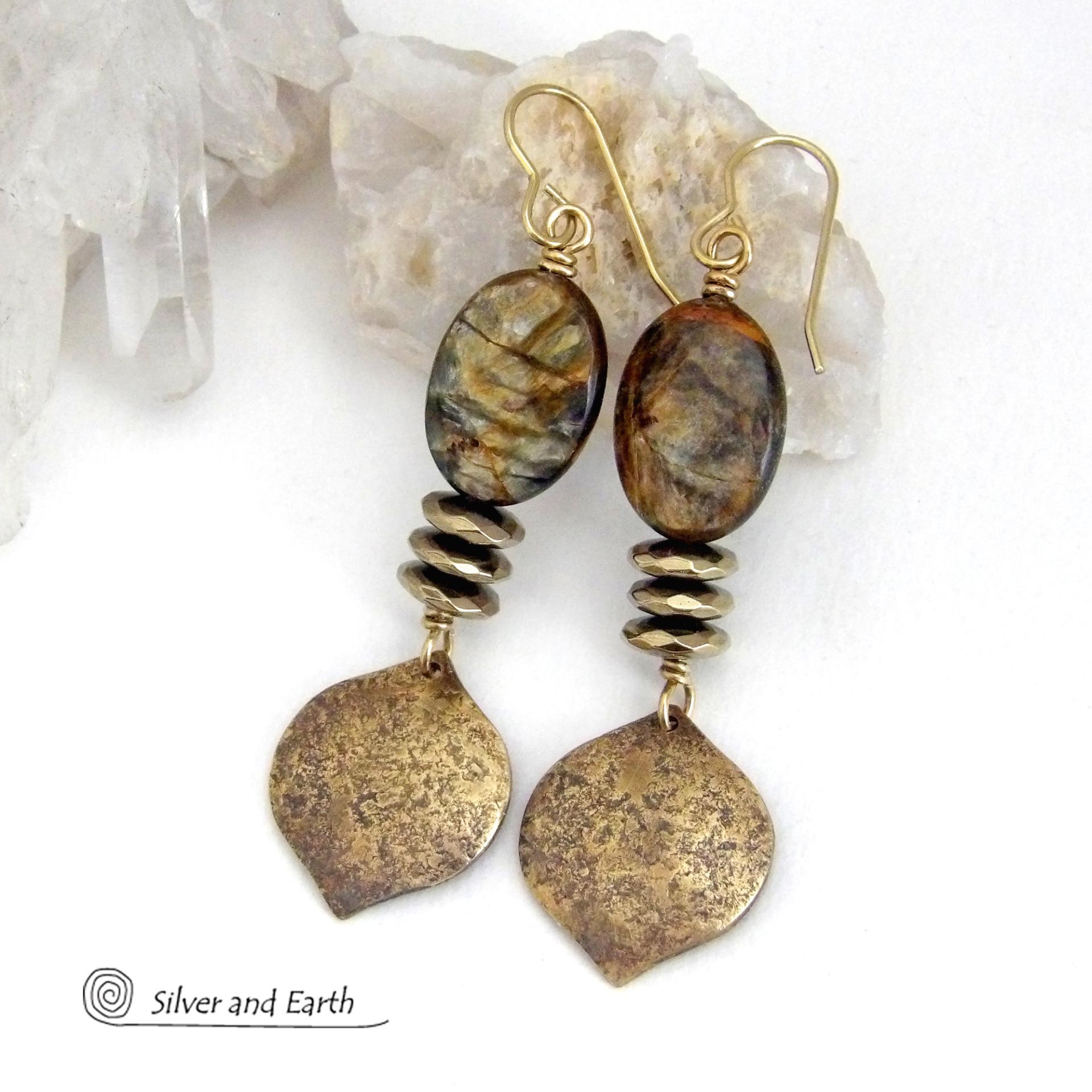 These handcrafted earrings feature gold brass dangles with a hammered organic texture accented with natural brown mica gemstones and faceted hematite stones with an electroplated champagne gold finish. The stones have a beautiful brown hue with undertones of shimmery gold and a faceted finish which casts off a natural sparkle and shine. They have a modern, chic and elegant style that coordinates beautifully with all wardrobe types - dressed up or down.