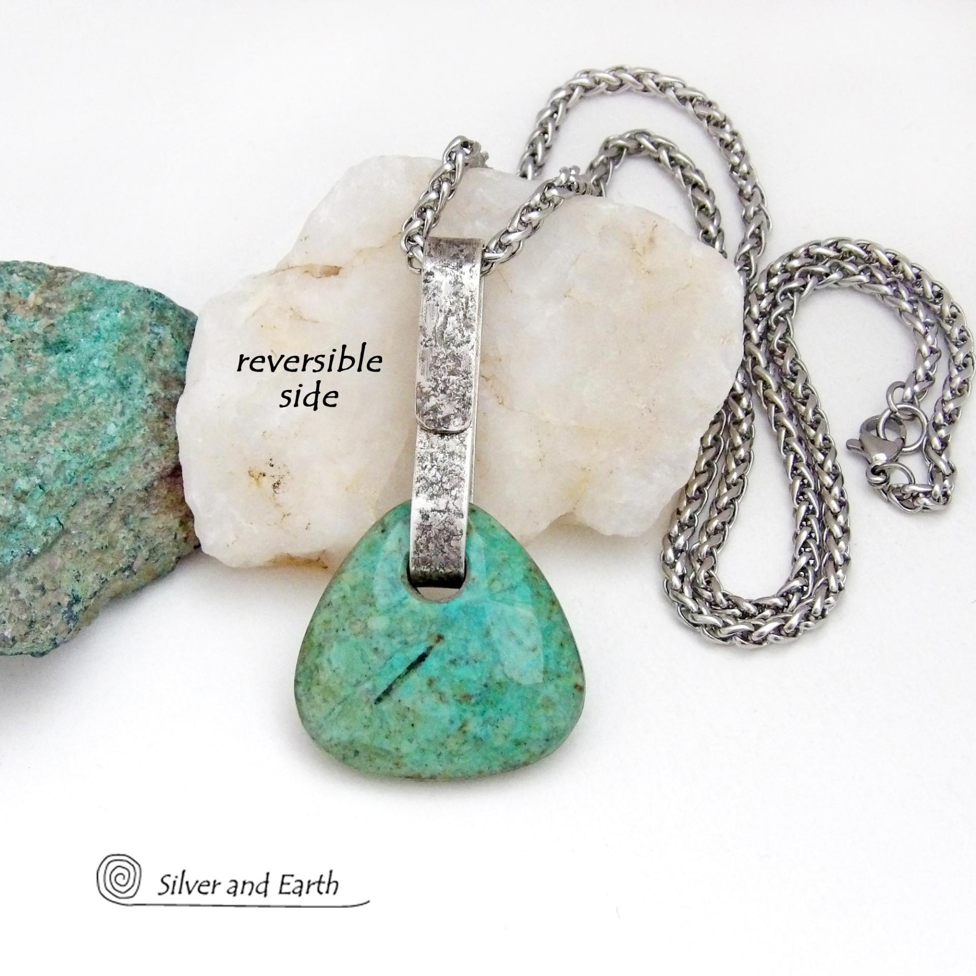 This one-of-a-kind pendant necklace features a beautiful chunky natural chrysocolla gemstone with a faceted finish. The stone is a beautiful shade of bluish-green which resembles turquoise. It hangs from a hand forged solid sterling silver bail with a lightly hammered organic texture. It's reversible. Unique and one-of-a-kind, it's sure to make a statement. Handmade in the USA by Silver and Earth Jewelry.