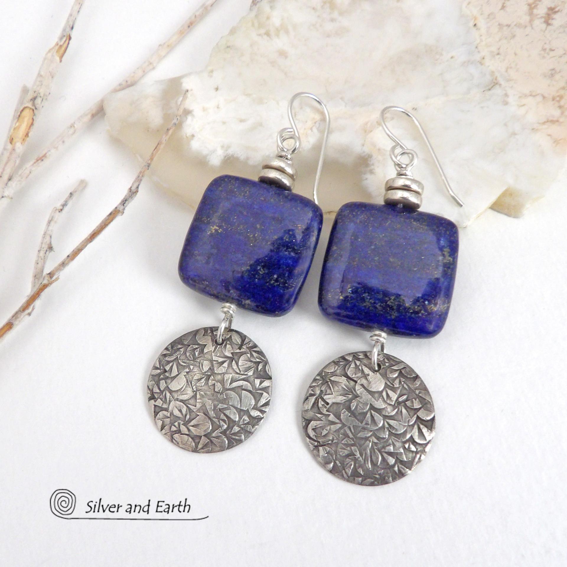 These earrings feature natural lapis lazuli gemstones accented with textured sterling silver dangles. The stones have a beautiful deep blue hue with natural pyrite inclusions. They are topped off with tiny pewter beads. The design is modern, classic, elegant and always in style. They'll coordinate beautifully with all wardrobe types. Handmade in the USA by Silver and Earth Jewelry. 