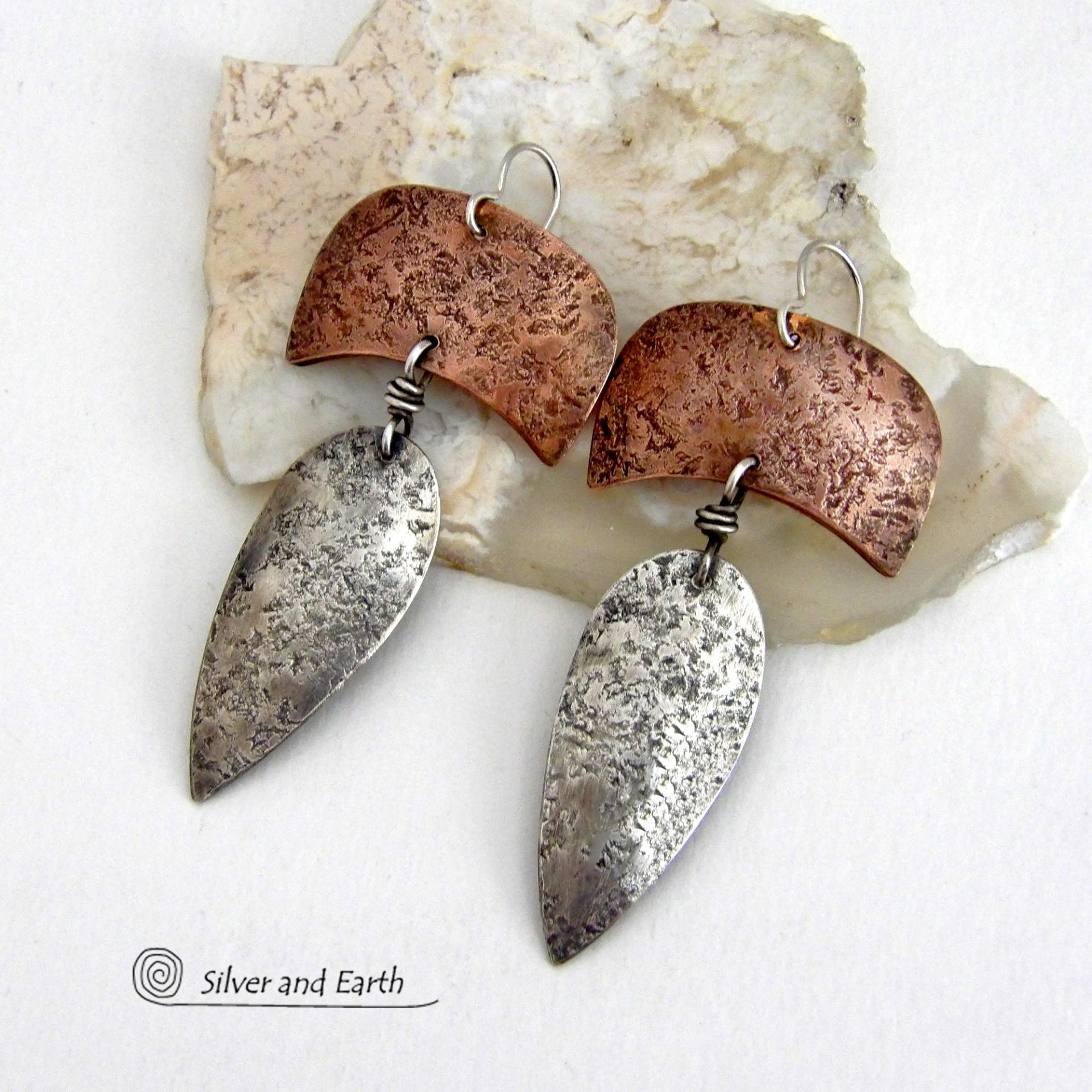 These handcrafted sterling silver and copper mixed metal earrings have an earthy, organic style with a modern tribal vibe. Unique and versatile, the combination of metals enables them to mix and match with other copper and silver accessories in your wardrobe. Handmade in the USA by Silver and Earth Jewelry.