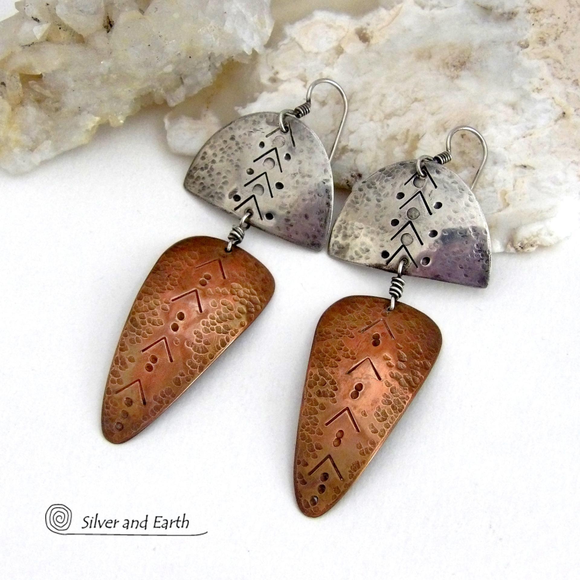 Unique and striking, these handcrafted mixed metal sterling silver and copper earrings will make a bold statement. They have a modern contemporary style with a tribal vibe. The combination of metals will mix and match beautifully with other copper and silver accessories in your wardrobe. Handmade in the USA by Silver and Earth Jewelry.