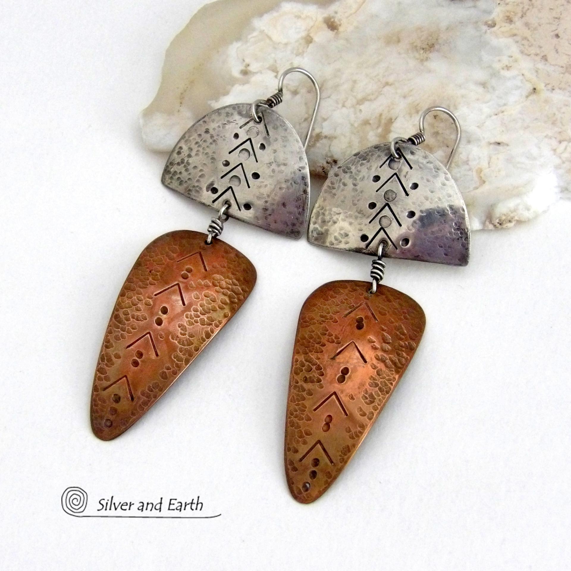 Unique and striking, these handcrafted mixed metal sterling silver and copper earrings will make a bold statement. They have a modern contemporary style with a tribal vibe. The combination of metals will mix and match beautifully with other copper and silver accessories in your wardrobe. Handmade in the USA by Silver and Earth Jewelry.