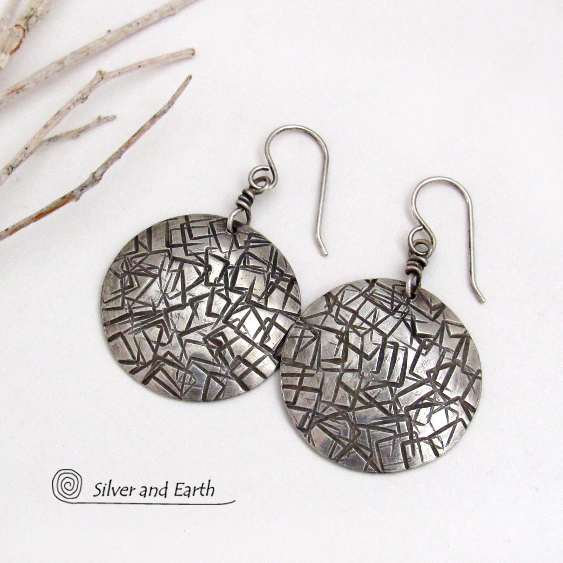 These handcrafted sterling silver earrings have a simplistic, modern style that is perfect for everyday wear because they go with everything. They have a hand stamped abstract texture that was oxidized to highlight the details. Lightweight and comfortable to wear, they'll coordinate beautifully with all wardrobe styles. 