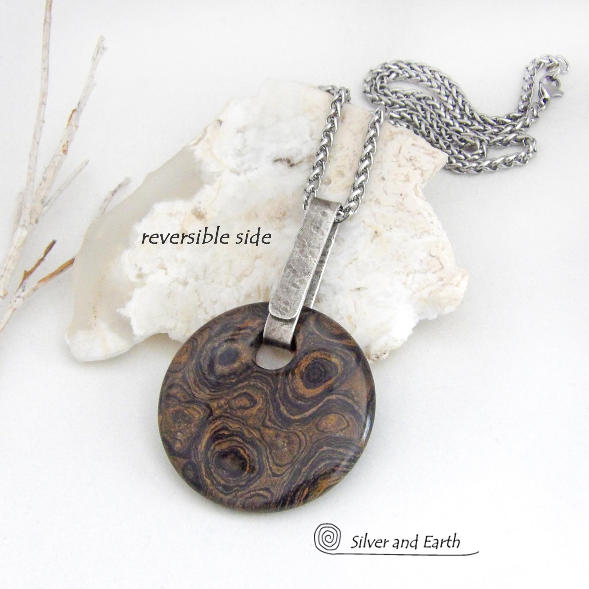 This one-of-a-kind necklace features a natural stromatolite fossil stone accented with a hand forged sterling silver bail with a lightly hammered organic texture. Stromatolites are fossilized layered deposits of algae within ancient sedimentary rock. These old single-celled organisms are believed to be some of the first forms of life on this planet.