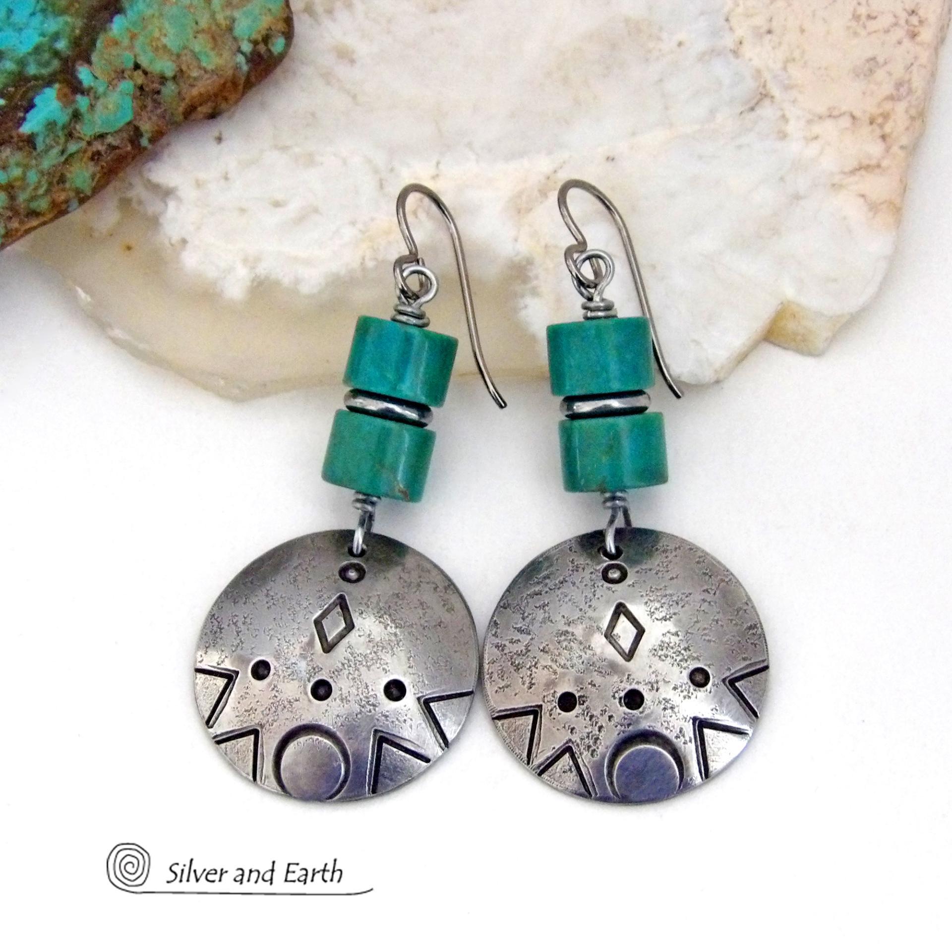 These handcrafted earrings feature silver pewter dangles with a hand stamped texture accented with natural turquoise stones and stainless steel spacer beads. They have a bold modern style with southwestern flair and will make a unique striking statement. They'll make a great gift for anyone that loves turquoise stones and southwest style jewelry. Handmade in the USA by Silver and Earth Jewelry.
