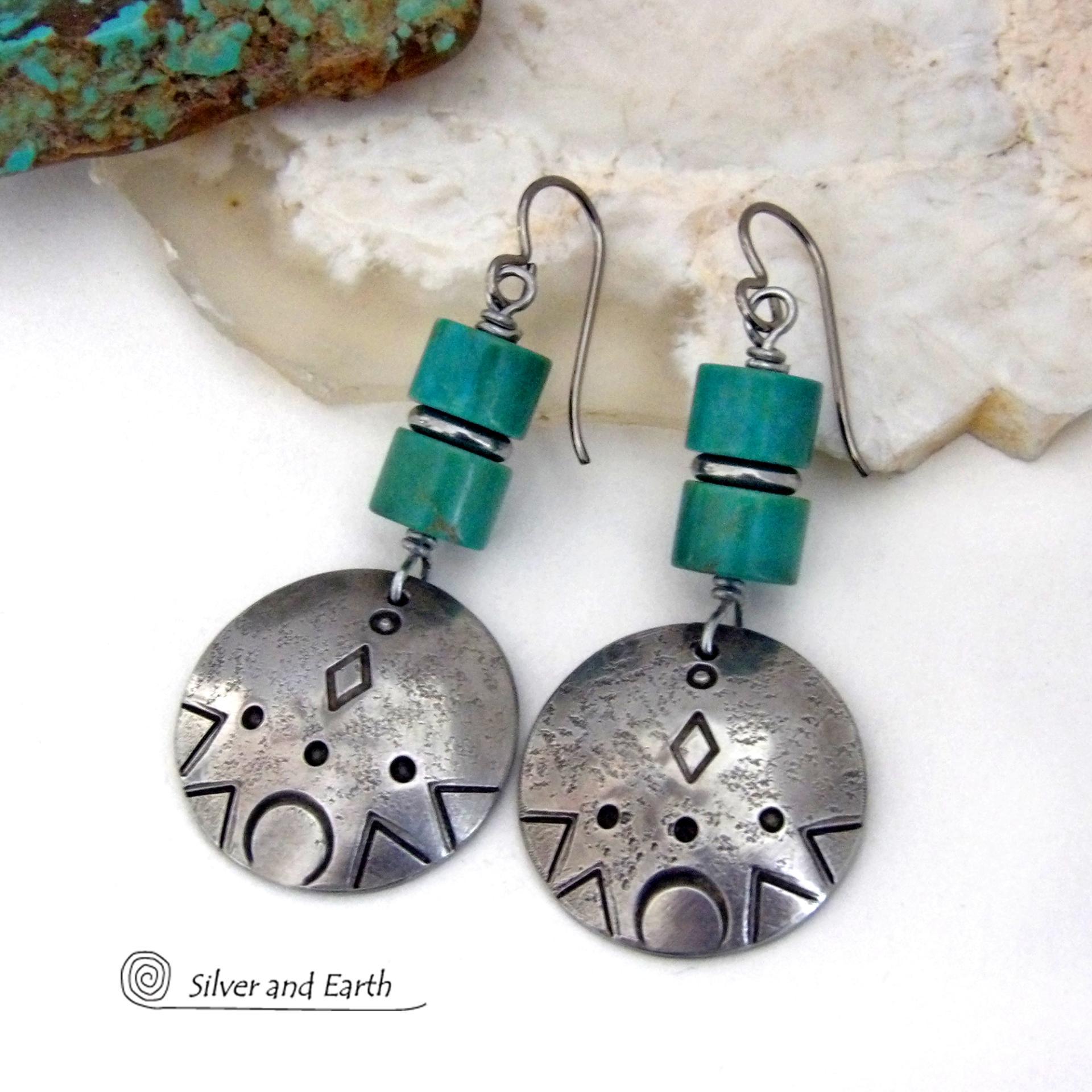 These handcrafted earrings feature silver pewter dangles with a hand stamped texture accented with natural turquoise stones and stainless steel spacer beads. They have a bold modern style with southwestern flair and will make a unique striking statement. They'll make a great gift for anyone that loves turquoise stones and southwest style jewelry. Handmade in the USA by Silver and Earth Jewelry.