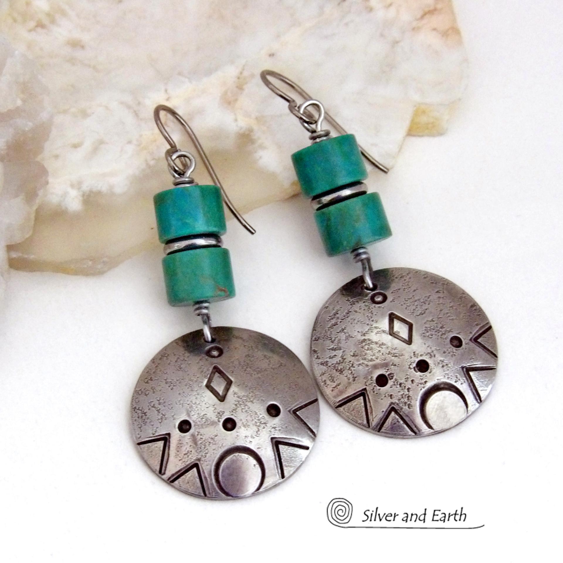 These handcrafted earrings feature silver pewter dangles with a hand stamped texture accented with natural turquoise stones and stainless steel spacer beads. They have a bold modern style with southwestern flair and will make a unique striking statement. They'll make a great gift for anyone that loves turquoise stones and southwest style jewelry. Handmade in the USA by Silver and Earth Jewelry.
