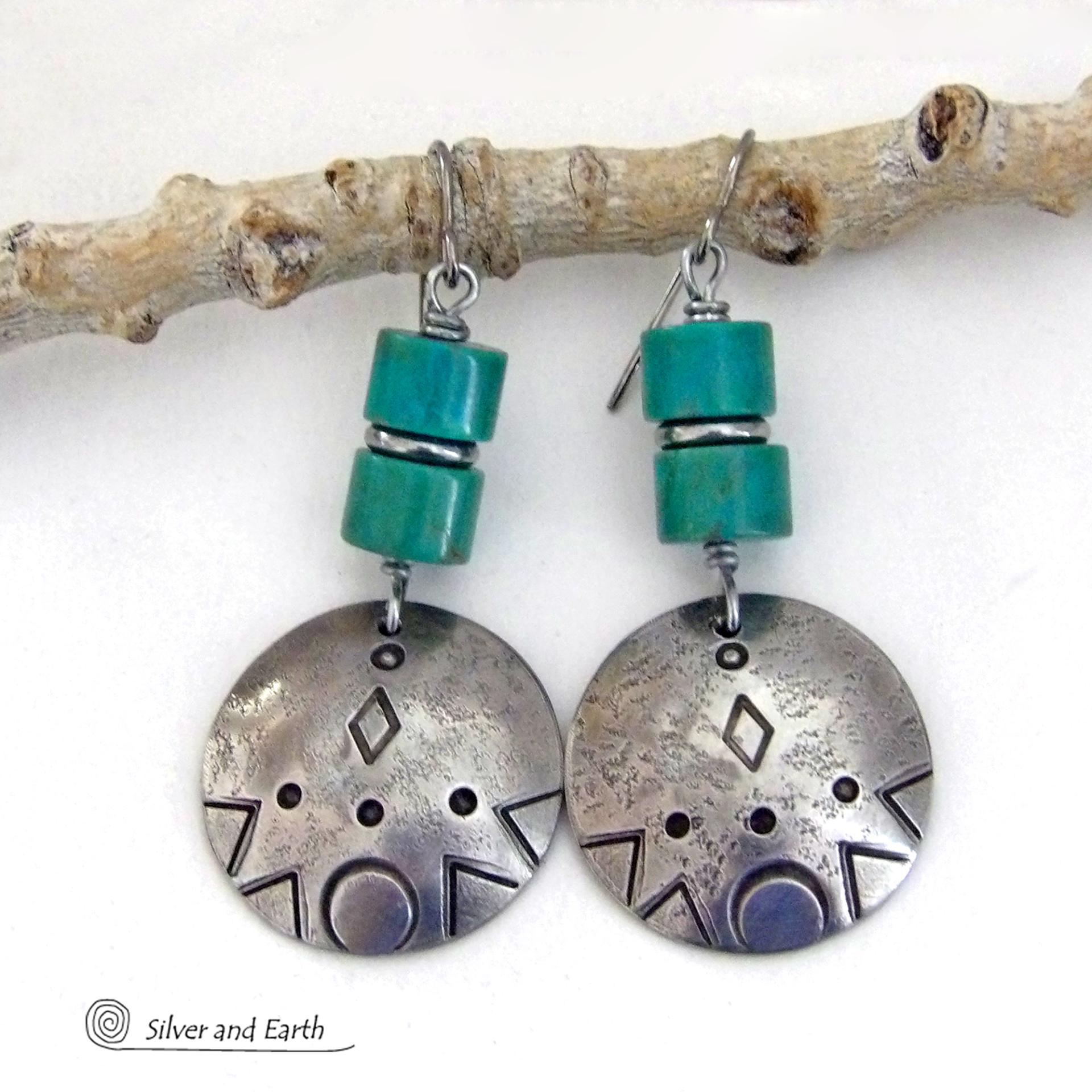 These handcrafted earrings feature silver pewter dangles with a hand stamped texture accented with natural turquoise stones and stainless steel spacer beads. They have a bold modern style with southwestern flair and will make a unique striking statement. They'll make a great gift for anyone that loves turquoise stones and southwest style jewelry. Handmade in the USA by Silver and Earth Jewelry.